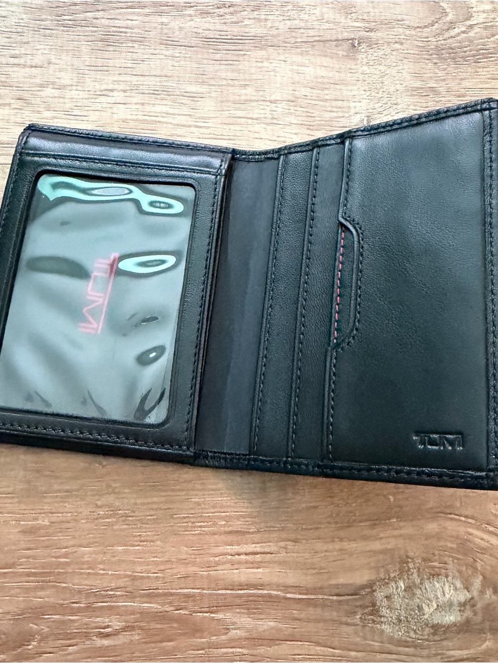 TUMI black L-fold wallet